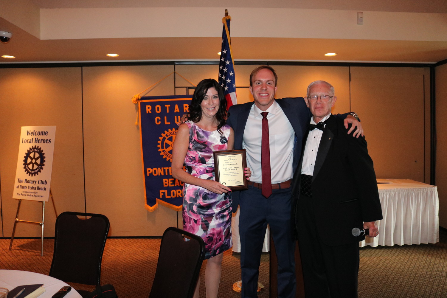 On behalf of Connor Dunwoodie, Rotarian Jennifer Logue receives the Local Heroes Youth Award from Ponte Vedra Recorder Editor Jon Blauvelt (center) and Rotarian Chuck Day (right).